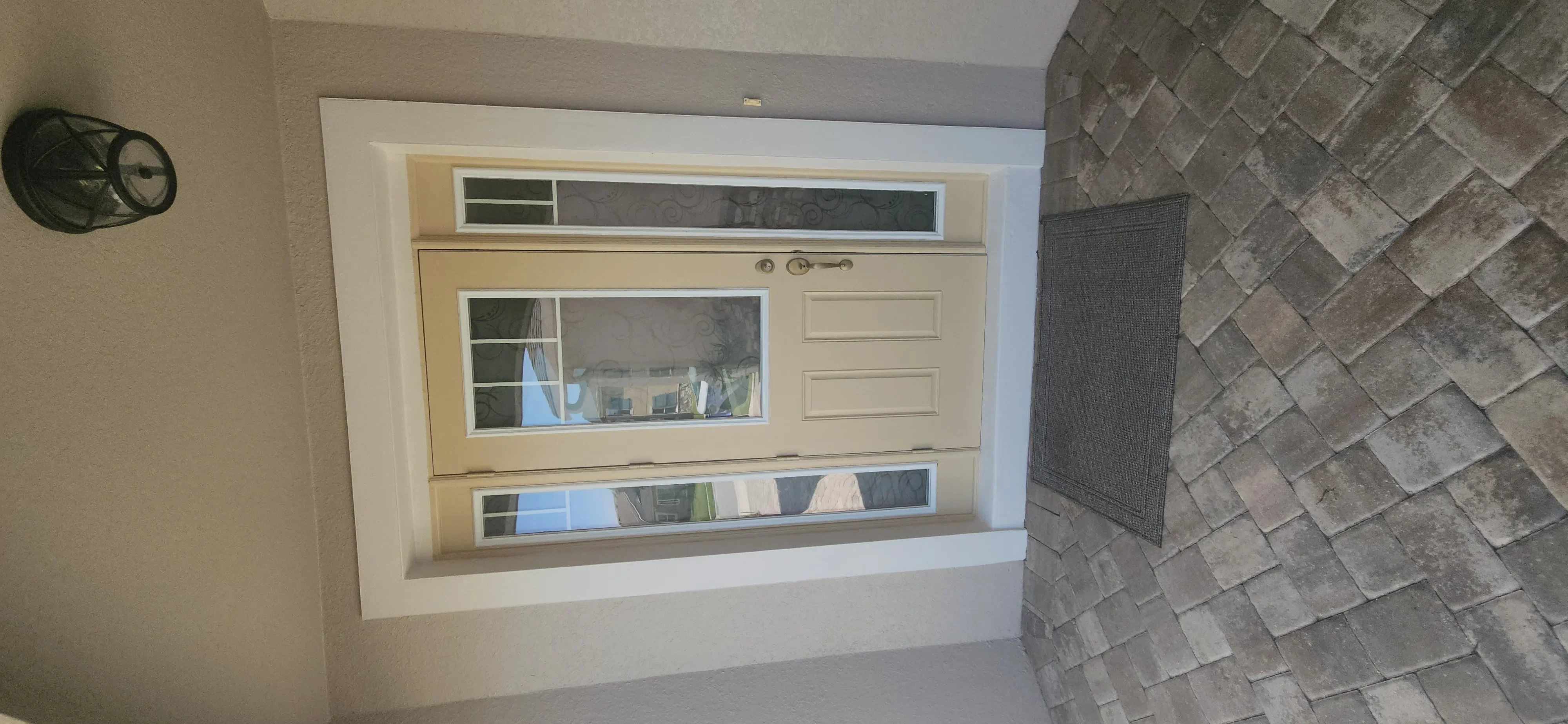 Freshly painted interior walls with window trim and herringbone tile accent wall